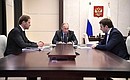 Meeting with Minister of Economic Development Maxim Oreshkin (right) and Industry and Trade Minister Denis Manturov.
