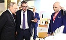 Ahead of the session of the Agency for Strategic Initiatives (ASI) forum, the President toured an exhibition of concepts that won awards at a competition for the best new national brands. Photo: Sergei Savostyanov, TASS