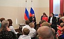 Meeting with residents of the Irkutsk Region who took part in relief efforts following flash floods in the region, as well as with flood victims.