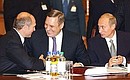 President Vladimir Putin with Belarusian President Alexander Lukashenko and Russian Prime Minister Mikhail Kasyanov, centre, before a meeting of the Council of CIS Heads of State.