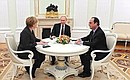 С Федеральным канцлером Германии Ангелой Меркель и Президентом Франции Франсуа Олландом.