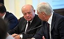 Before the start of a Security Council meeting. Director of the Foreign Intelligence Service Mikhail Fradkov and permanent member of the Security Council Boris Gryzlov.