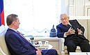 At a meeting with former US Secretary of State Henry Kissinger.