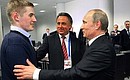 Vladimir Putin congratulated Captain of the Russian junior hockey team Ivan Barbashev on the Russian team’s first victory in the 2013 world junior hockey championship. Sports Minister Vitaly Mutko (centre).
