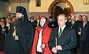 President Vladimir Putin and his wife, Lyudmila, attending a commemoration service for the victims of the terrorist attack of September 11 at St Nicholas\' Cathedral. His Eminence Mercury, Bishop of Zaraisk, the Administrator of the Patriarchal Parishes of the Russian Orthodox Church in the US, to the left.