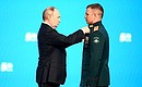 At the gala event celebrating 50 years since the start of the Baikal-Amur Railway construction. The Order For Military Merit is awarded to Lieutenant Colonel of the Defence Ministry’s Railway Troops Alexei Volkov. Photo: Vladimir Astapkovich, RIA Novosti