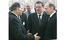 President Vladimir Putin and German Chancellor Gerhard Schroeder visiting the Ioffe Institute of Physics and Technology, Russian Academy of Sciences. The head of the institute, Nobel Prize laureate Zhores Alfyorov, showing the two leaders around research facilities.