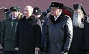 With Defence Minister Sergei Shoigu during a wreath-laying ceremony at the Tomb of the Unknown Soldier.