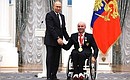 Presenting state decorations to winners of the 2020 Summer Paralympic Games in Tokyo. Ruslan Kuznetsov, cycling champion of the Paralympics, receives the Order of Friendship. Photo: RIA Novosti