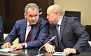 Before the meeting with permanent members of the Security Council. Defence Minister Sergei Shoigu (left) and Foreign Intelligence Service Director Mikhail Fradkov.