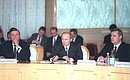 Acting President Vladimir Putin at a meeting of the Russian Government\'s Advisory Council on Foreign Investment. Vladimir Putin with State Duma Speaker Gennady Seleznev (left) and First Deputy Prime Minister Mikhail Kasyanov.