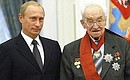 President Putin presenting state awards. President Putin with Academician Vladimir Kotelnikov who received the Order of Service to the Fatherland, First Class.