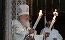 Patriarch Kirill of Moscow and All Russia with the Holy Fire from Jerusalem during the divine Easter service at the Christ the Saviour Cathedral.