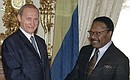 President Vladimir Putin meeting with Gabonese President Omar Bongo.