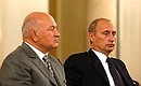 President Putin attending the Third Congress of the United Russia Party with Moscow Mayor Yury Luzhkov, co-chairman of the Party\'s Supreme Council. 