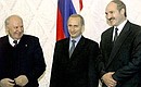 Signing joint agreements after a meeting of the Supreme State Council of the Union State of Russia and Belarus. President Putin with Belarusian President Alexander Lukashenko and Federation Council Speaker Yegor Stroyev.