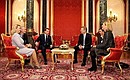 Conversation between Svetlana Medvedeva, Dmitry Medvedev, Christian Wulff and Bettina Wulff.