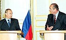 President Putin with French President Jacques Chirac during a news conference.
