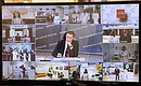 Участники видеоконференции по случаю открытия в ряде регионов Российской Федерации новых объектов здравоохранения.