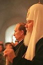 President Vladimir Putin and Alexii II, the Patriarch of Moscow and All Russia, at a commemoration service for troops of the 104th Airborne Regiment, Pskov Airborne Division, who were killed in a military operation in Chechnya.