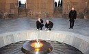 Laying flowers at the Armenian Genocide Memorial. With President of Armenia Serzh Sargsyan.