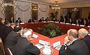 President Putin meeting with Italian businessmen.