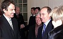 PETERSBURG. Vladimir Putin and British Prime Minister Tony Blair.