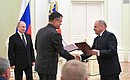 Deputy Prime Minister Maxim Akimov (left) and First Deputy Director General of Rosatom State Corporation Ivan Kamenskikh signed an agreement of intent on quantum computing.