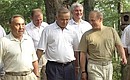 President Putin and other CIS heads of state walking in the park.