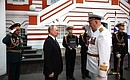 Before the ceremony for the signing of the Executive Order On Approving the Naval Doctrine of the Russian Federation, and the Executive Order On Approving the Russian Navy Regulations. With Defence Minister Sergei Shoigu and Commander-in-Chief of the Russian Navy Nikolai Yevmenov (right).