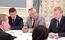 Deputy Prime Minister Dmitry Kozak, Interior Minister Vladimir Kolokoltsev and Director of the Federal Service for Hydrometeorology and Environmental Monitoring Alexander Frolov (right) at the meeting on the situation in the regions affected by severe weather.