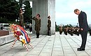 President Putin laying a wreath at a monument to the liberating Soviet Army.