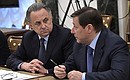 Deputy Prime Minister Vitaly Mutko and Deputy Prime Minister Alexander Khloponin before a meeting with Government members.