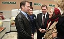 Visiting Veteran state social food shop. With Governor of Kursk Region Alexander Mikhailov (centre).