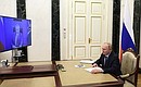 Meeting with Novosibirsk Region Governor Andrei Travnikov (via videoconference).