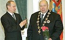 President Putin presenting the Order of St. Apostle Andrew the First-Called to Valery Shumakov, director of the Russian Research Institute of Transplantology and Artificial Organs, at a decoration ceremony in the Kremlin.