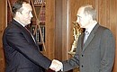 Vladimir Putin and the Russian Transport Minister Sergei Frank.