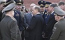 President Putin talking with veterans after laying a wreath at the Eternal Flame.