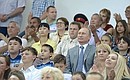 Vladimir Putin watches competition at the sports festival for large families From a Sports-loving Family to Olympic Victory.