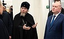 Metropolitan Tikhon (Shevkunov) of Pskov and Porkhov, chairman of the Patriarchal Council for Culture and Governor of Sevastopol Mikhail Razvozhayev (on the right). Photo: Anna Sadovnikova