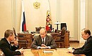 With FSB Director Nikolai Patrushev (right) and Prosecutor-General Yury Chaika.