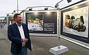 Sergei Ivanov visited a photo exhibition on tigers and leopards.
