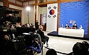 Making press statements following Russian-South Korean talks.
