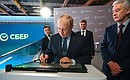 Vladimir Putin signs the high-speed railway map. Photo by Kristina Kormilitsyna (”Rossiya Segodnya“)