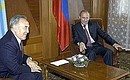 President Putin meeting with Kazakh President Nursultan Nazarbayev.