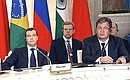 . With Presidential Aide Sergei Prikhodko (on the right) and Deputy Prime Minister and Finance at a meeting of BRIC Group leaders in expanded format. 