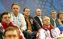 At ice sledge hockey match between Russia and South Korea. From left: Sports Minister Vitaly Mutko, Prime Minister Dmitry Medvedev, and President of the International Olympic Committee Thomas Bach.