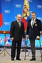 Meeting with XI Winter Paralympics medallists. Vasily Varlakov, silver medallist in sledge hockey, was awarded the Medal of the Order for Services to the Fatherland I degree.