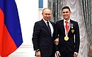 Presenting state decorations to winners of the 2020 Summer Paralympic Games in Tokyo. Ilnur Garipov, swimming champion of the Paralympics, receives the Order of Friendship. Photo: RIA Novosti