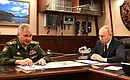 With Defence Minister Sergei Shoigu. Photo: Alexei Danichev, RIA Novosti